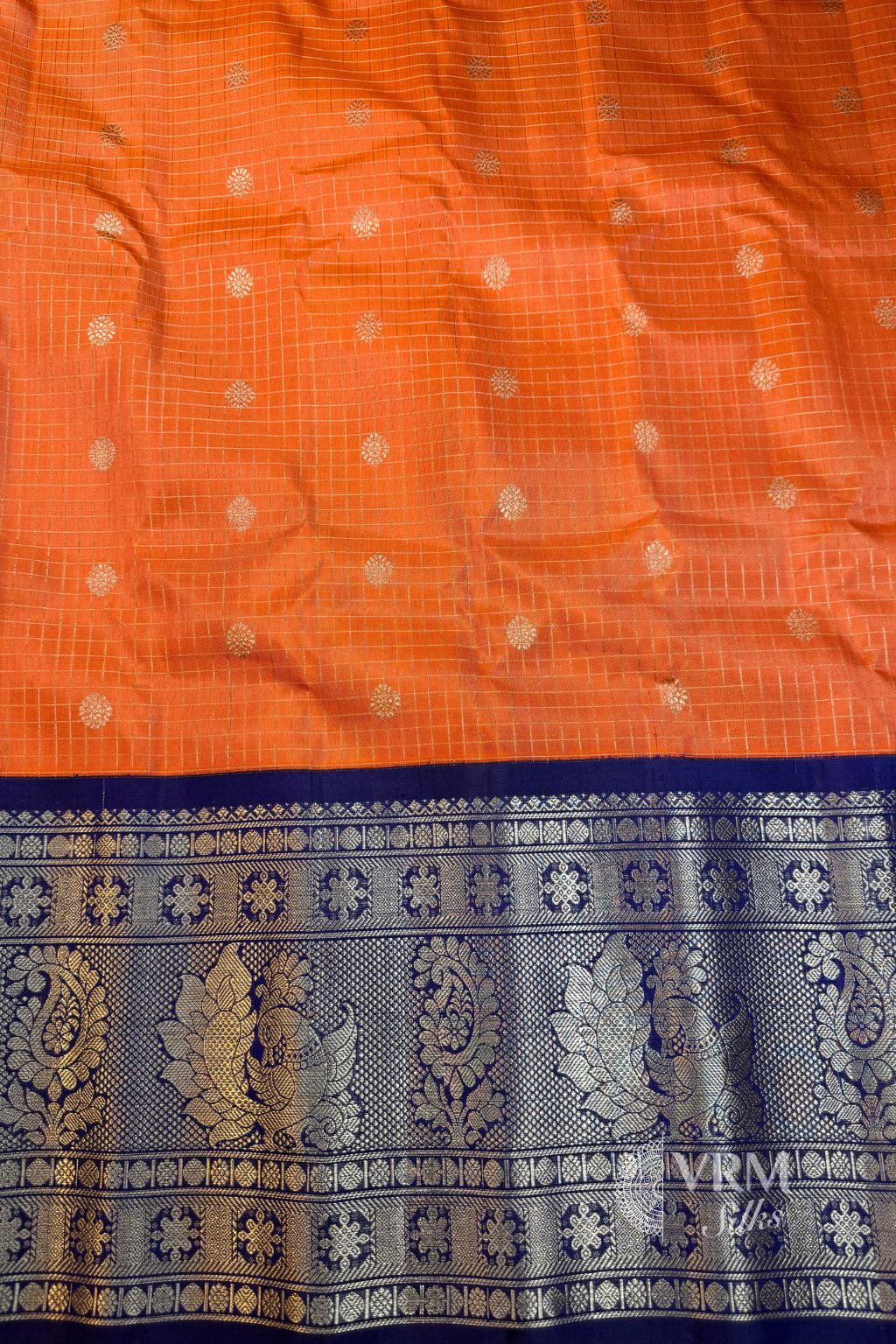 Traditional Orange Gadwal Saree Handwoven with Silver Detailing Traditional Orange Gadwal Saree Handwoven with Silver Detailing